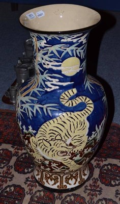 Lot 853 - A large Continental pottery vase, incised with tigers, on a blue ground, impressed B.H.M, 62cm