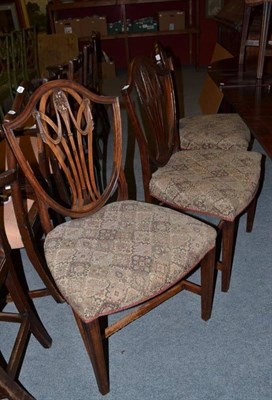 Lot 865 - A set of George III Hepplewhite design dining chairs, with shield shape back supports, above...