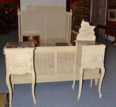 Lot 877 - French bed with heal's divan base and two painted and marble top bed side cabinets