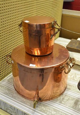 Lot 878 - A large copper circular pan with spigot and a smaller pan with lid