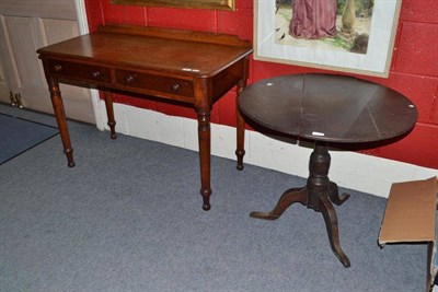 Lot 887 - A Victorian mahogany writing table fitted two drawers and a George III oak tripod table