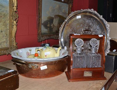 Lot 901 - Copper two handled bowl, two bottle tantalus, silver plated tray, wash basic, teapot and butter...