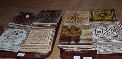 Lot 915 - Assorted hand painted and printed pottery tiles (two trays)