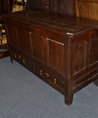 Lot 921 - A joined oak chest with hinged lid and carved initials 'M.D.1779'