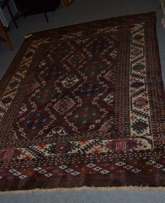 Lot 932 - Chodor rug West Turkestan, the aubergine field with a lattice of guls enclosed by borders of...