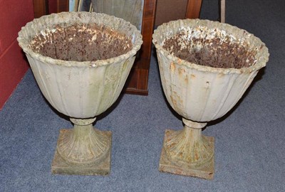 Lot 951 - Pair of campana shaped cast iron urns