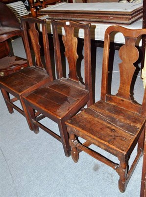 Lot 958 - Three 18th century oak dining chairs with vasiform shaped splats and solid seats