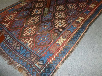 Lot 993 - Karabagh Rug South Caucasus, the honeycomb lattice field of hooked devices enclosed by narrow...