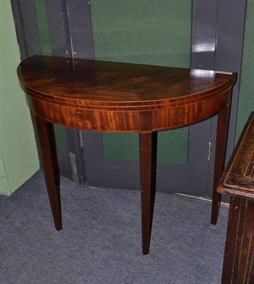 Lot 1005 - George III mahogany fold over tea table