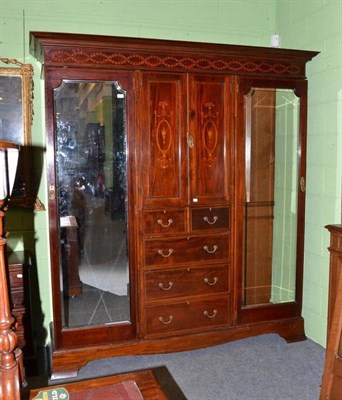 Lot 1009 - An Edwardian mahogany and marquetry triple door wardrobe