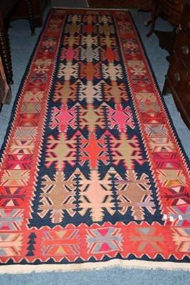 Lot 1034 - North East Anatolian Kilim The abrashed field with three columns of hooked medallions enclosed...