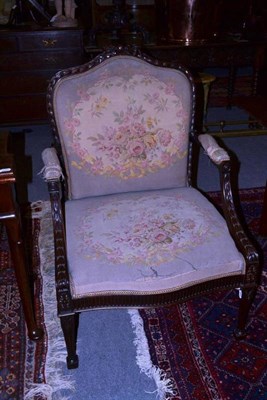 Lot 1045 - An Edwardian mahogany Adams style open armchair, early 20th century, upholstered in floral...