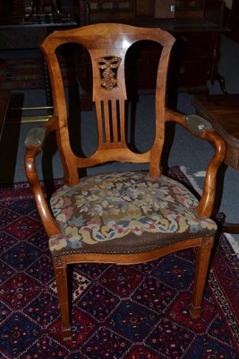 Lot 1047 - A 19th century Dutch fruitwood armchair, with ribbon tied floret pierced grille splat, shaped...