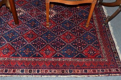 Lot 1048 - Afshar rug south east Persia, the stepped honeycomb lattice field enclosed by narrow borders,...