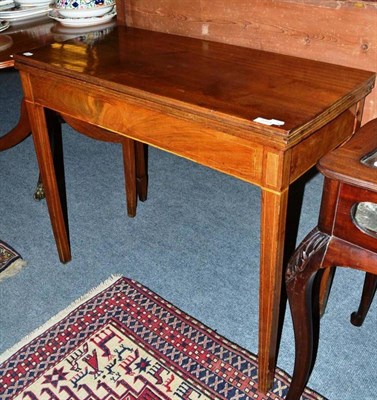 Lot 1054 - A 19th century mahogany fold over tea table