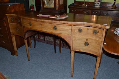 Lot 1057 - George III mahogany serpentine sideboard