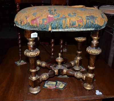 Lot 1084 - Ebonised and gilded upholstered dressing stool