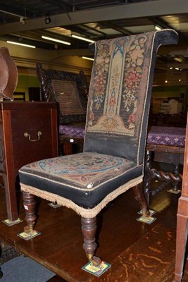 Lot 1097 - A Victorian prayer chair with original needlework upholstery