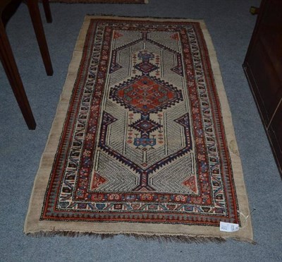 Lot 1104 - Sarab rug Persian Azerbaijan, camel ground with a serrated panel centred by a madder medallion...