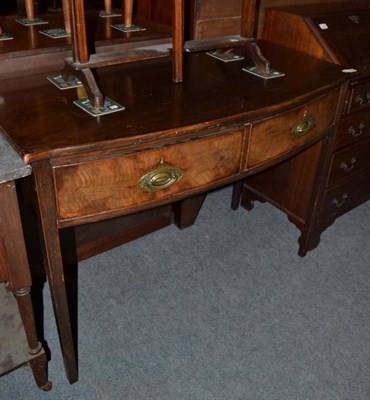 Lot 1135 - A mahogany two drawer serving table