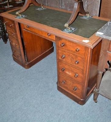 Lot 1137 - A Victorian mahogany double pedestal desk fitted cupboards doors with false drawers