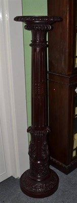 Lot 1153 - A 19th century mahogany torchere with a canthus carved and column support