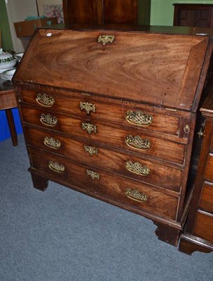 Lot 1157 - A Georgian mahogany bureau