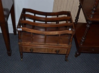 Lot 1180 - A 19th century mahogany three division Canterbury, fitted with a single drawer on turned legs...