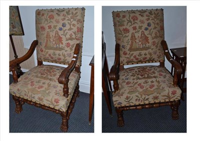 Lot 1185 - Pair of walnut open armchairs on carved paw feet