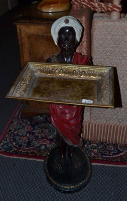 Lot 1197 - A composition Blackamoor figure modelled as a young male holding a gilt rectangular tray