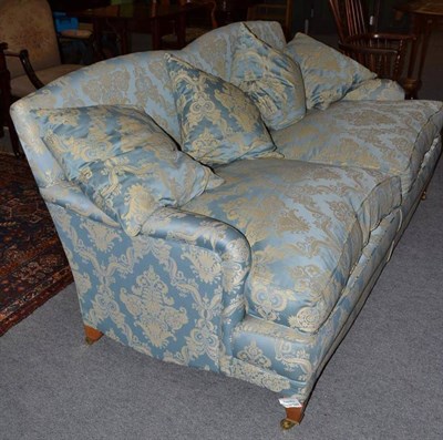 Lot 1210 - Reproduction two seater sofa on square tapering legs with brass toes, upholstered in blue