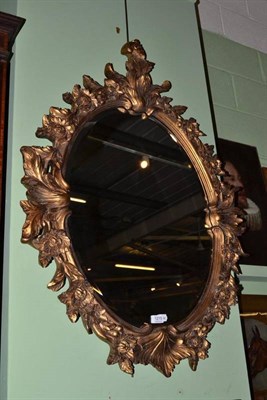 Lot 1215 - Gilt oval mirror