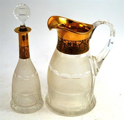 Lot 7 - A Moser Lemonade Jug, with a cut glass body and gilt rim, etched mark to base, 25cm high; and...