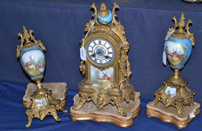 Lot 25 - A Gilt Metal and Porcelain Mounted Striking Mantel Clock Garniture, circa 1900, with swag and...
