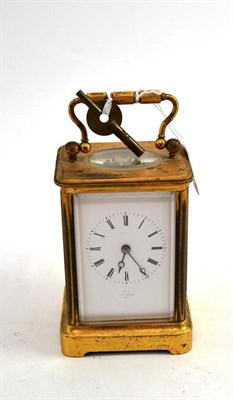 Lot 32 - A French Brass Striking Carriage Clock, retailed by Hy Marc, Paris, circa 1900, with carrying...