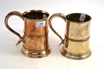 Lot 39 - Two Sheffield Plate Tankards, with stylised handles, 15cm high