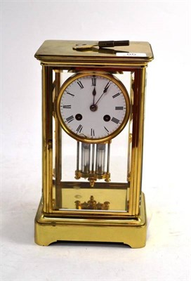 Lot 55 - A Brass Four Glass Striking Mantel Clock, circa 1890, with bevelled glass panels, 3-1/2-inch enamel