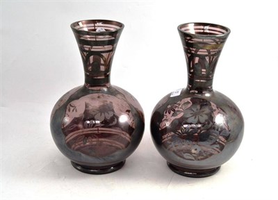 Lot 57 - A Pair of Amethyst Tinted Globular Vases, with trumpet necks and silvered decoration, 31cm high...