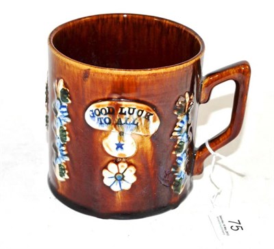 Lot 75 - A Measham Mug, 'Good luck to all', 11cm high