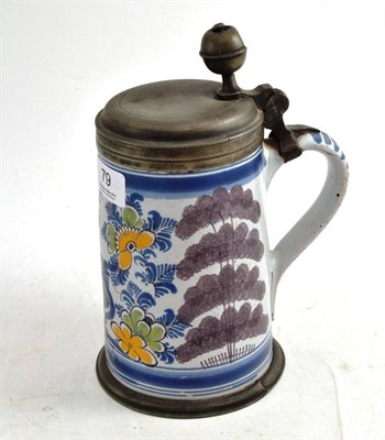 Lot 79 - A Tinglaze Pewter-Mounted Tankard, lid engraved with the initials A.R, 24cm high