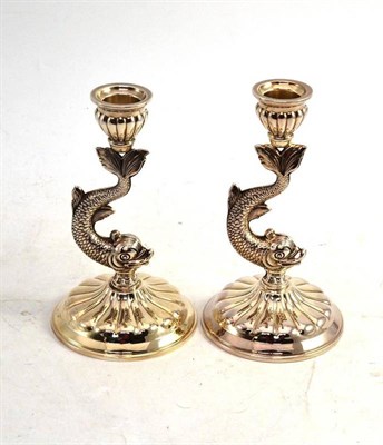 Lot 80 - A Pair of 925 Sterling Silver Candlesticks, the stems as dolphins, 16cm high