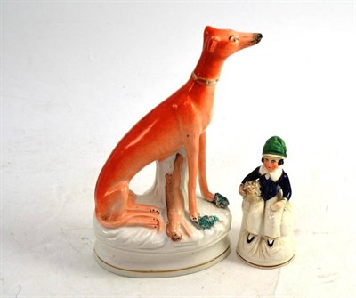 Lot 81 - A Victorian Staffordshire Figure of a Greyhound, 21cm high; and A Porcelain Figure of a Boy and...
