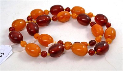 Lot 117 - An Amber Necklace, of various sized cherry and golden amber beads, length 70cm