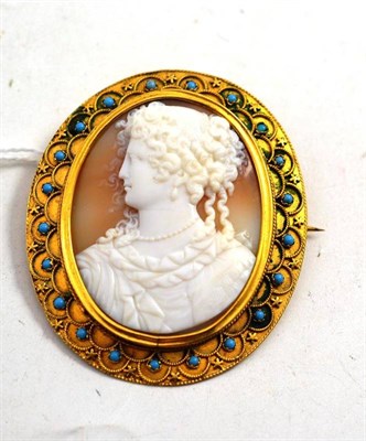 Lot 122 - A Cameo Brooch, of a maiden's shoulder length portrait, in a rope twist and star motif...