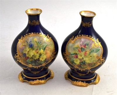 Lot 151 - A Pair of Royal Doulton Vases, painted by David Dewsberry, with floral sprays, on a blue ground...