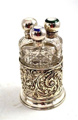 Lot 153 - A Late Victorian Three Bottle Scent Stand, Birmingham 1900, the pierced holder with provisions...