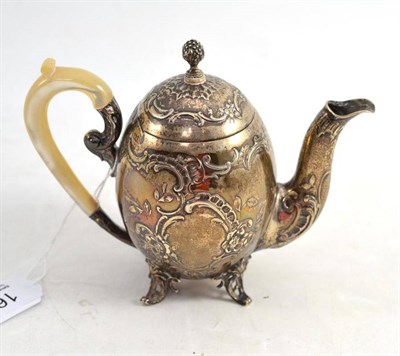 Lot 162 - An Embossed Silver Small Oval Shaped Teapot, with mother-of-pearl handle, 1897, 13cm high