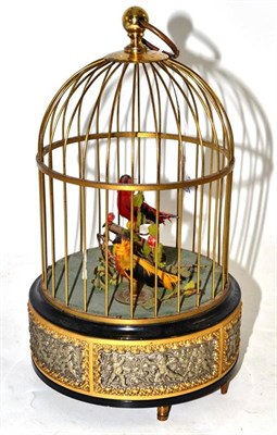 Lot 178 - A Late 20th Century Musical Bird Cage, the base decorated with putto, 25cm high
