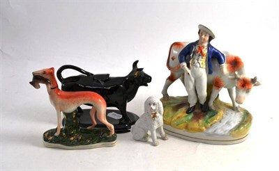 Lot 192 - A Late 19th Century Black Cow Creamer; A Staffordshire Style Figure Group; A Greyhound, and A...
