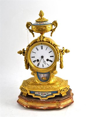 Lot 216 - A Gilt Metal and Porcelain Mounted Striking Mantel Clock, circa 1890, surmounted by an urn,...